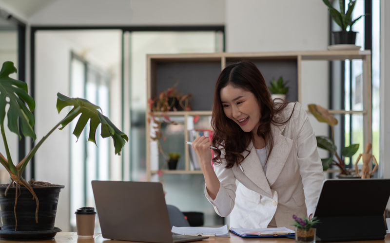 Indigo Private Label founder reviews skincare brand plans from her bright office workspace.