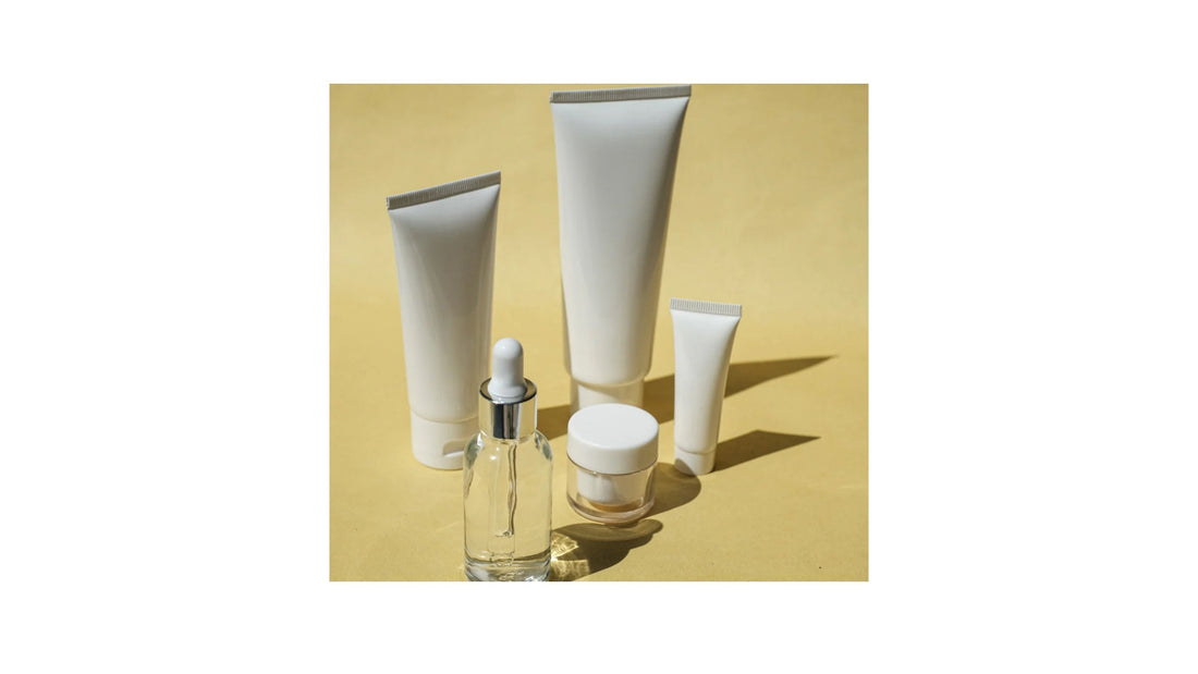 White label skincare tubes, jar, and clear dropper bottle from Indigo Private Label.